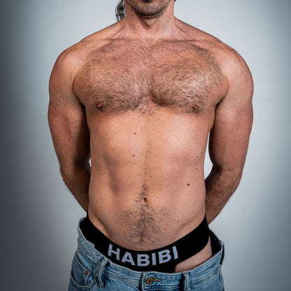 Model wearing the black 3EIB Habibi English jockstrap with HABIBI waistband and keffiyeh