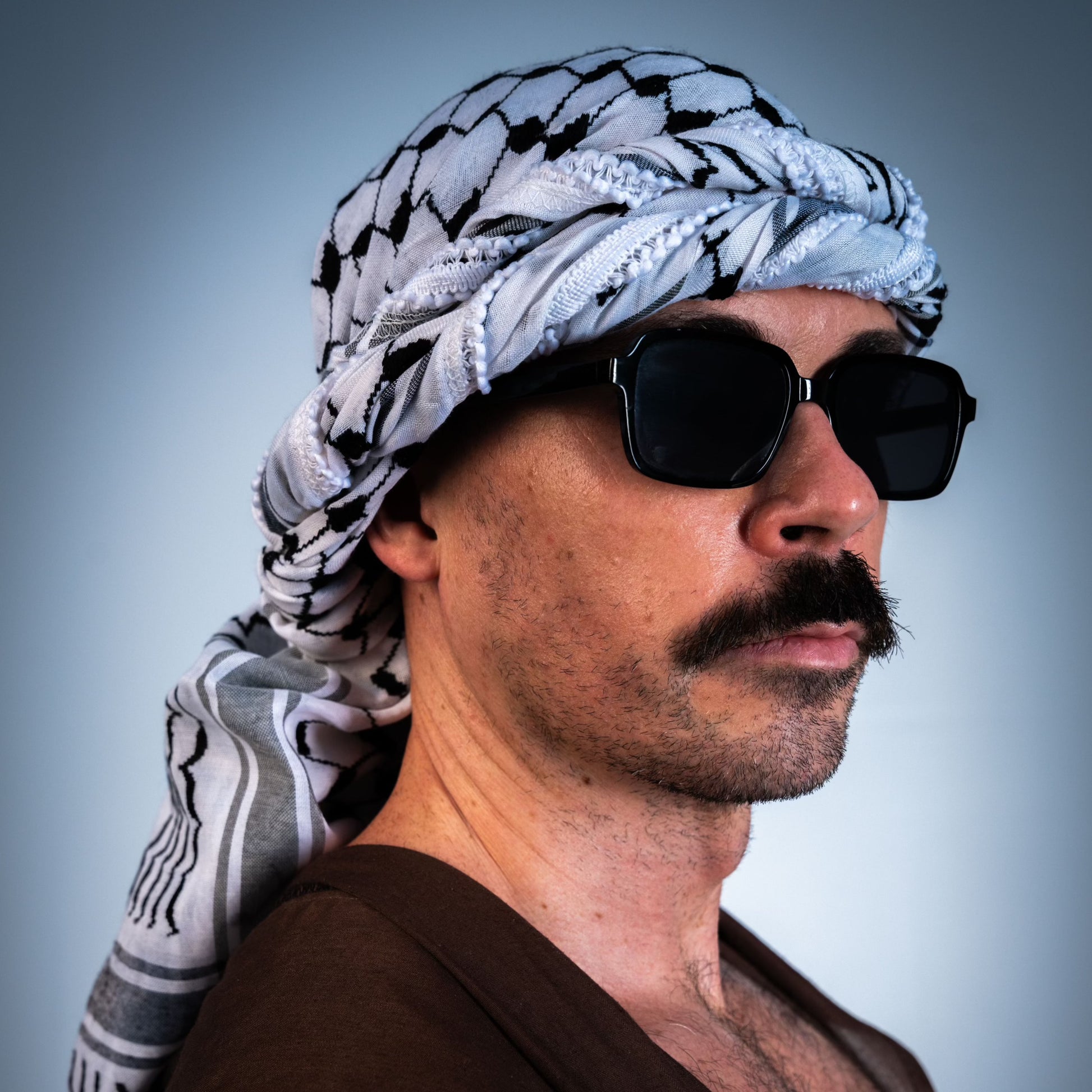 Black-and-white Palestinian keffiyeh with tasselled edge