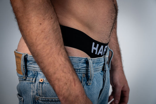 Close-up of the white HABIBI lettering and black English jockstrap waistband